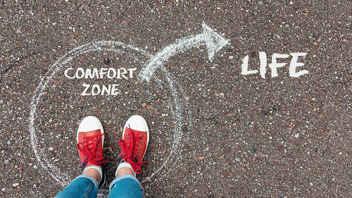 Red trainers inside a chalk Comfort zone circle with an arrow pointing to Life
